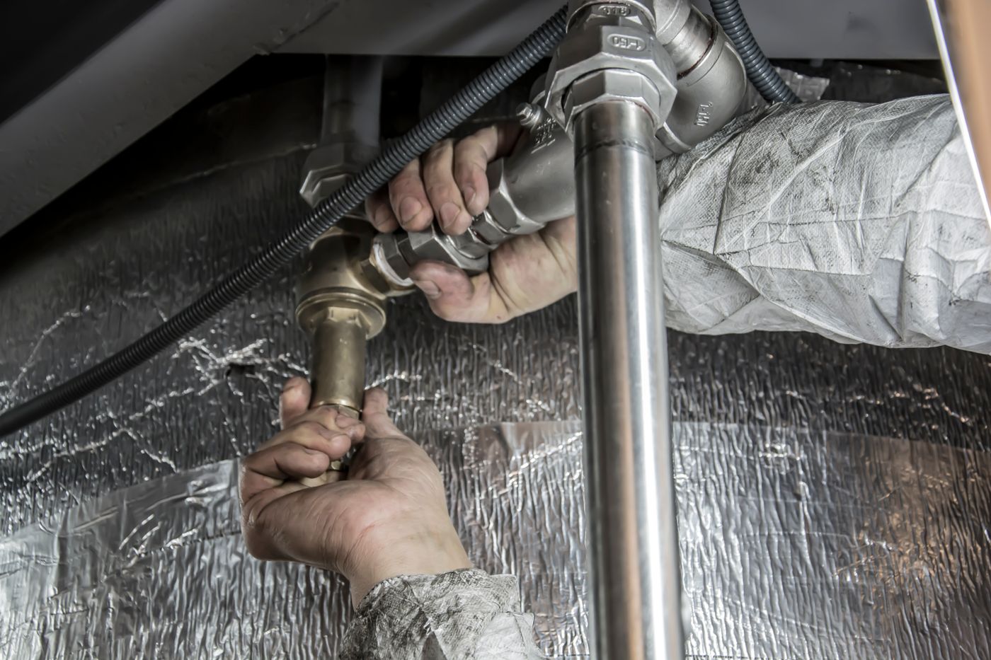 Plumbing pipe repair under a fixture